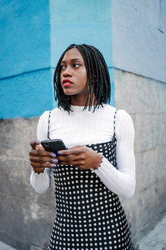 Stylish Woman On The Streets With Her Cellphone.