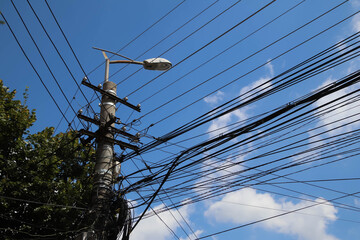 The chaos of cables and wires and the street light