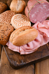 Big Mortadella and Tigelle. Assorted breads of different types, for traditional Italian sandwiches in the region of Emilia Romagna. Above. Copy space