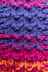 hand knitted wool texture in pink and purple 