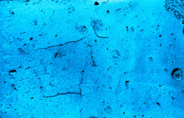 Blue grunge background. Cracked stone wall texture.