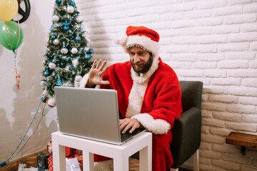 Happy Santa Claus waving hand video calling kid talking to child greeting on Merry Christmas, Happy...
