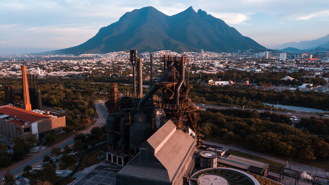 old-school factory in front of the mountain
