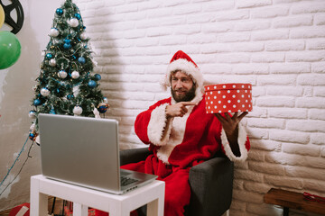 Happy Santa Claus and video calling kid talking to child greeting on Merry Christmas, Happy New...
