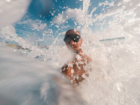 Selfie of a young man swimming in the ocean