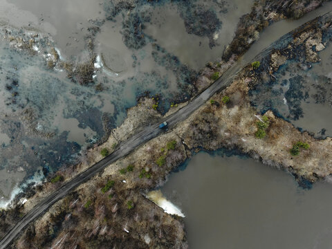 Cars crossing a flooded river