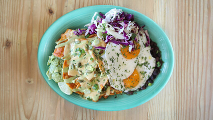 Chilaquiles plate with two eggs 