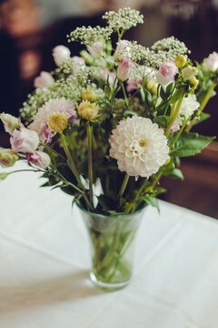 fresh summer bouquet in a vase on a white table