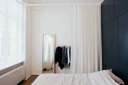 interior shot from a modern white loft with black cupboard