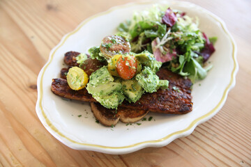 Vegan salad with avocado and tempeh