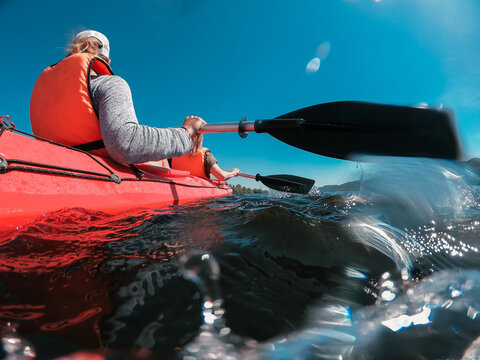 Two sisters go kayaking on a sunny summer day