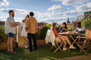 Friends Having A Gathering On A Rooftop.