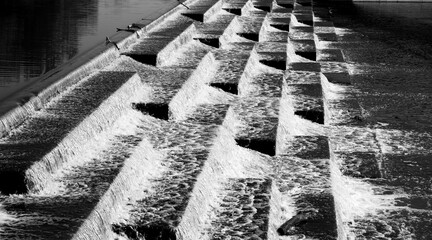 Water rushing over concrete water fall or water stairs at  White Rock Lake  in Dallas Texas