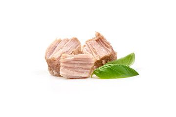 Canned Pork Meat with basil leaves, close-up, isolated on white background