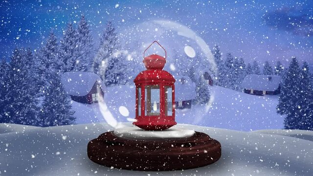 Animation of snow globe with lantern and winter scenery with snow falling over trees and houses