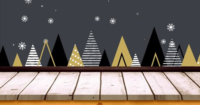 Animation of christmas trees and snow falling with wooden surface on grey background
