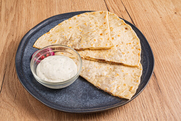 pita with bread on the wooden background