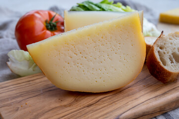 Cheese collection, French fol epi  cheese with many little holes and ossau iraty cheese