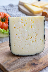 Cheese collection, French fol epi  cheese with many little holes, etorki, tomme noire des pyrenees and ossau iraty cheese