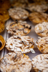 Traditional dessert pastry in Portugal, nata eggs cream cakes with almonds