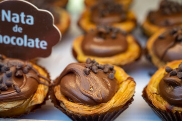 Traditional dessert pastry in Portugal, nata eggs cream cakes with chocolate