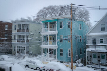 Snow falls on Boston neighborhood street