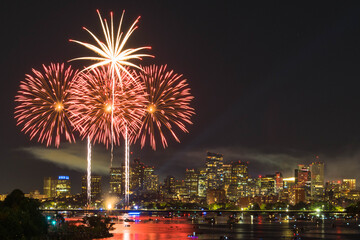 Bright red fireworks mark a Fourth of July Celebration in Boston