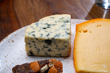 Tasting and pairing of different cheeses with strong alcoholic drinks, whisky, cognac or calvados