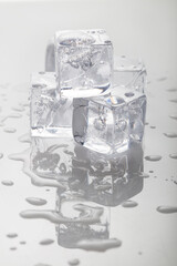 Stack of melting ice cubes in studio