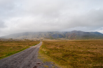 Path to mountain surrounded by clouds