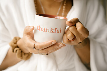 Woman drinking coffee at home in bed