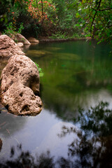 Shadow Of Tree On Rock By River
Beatiful waterfall and small lake in algeria with green trees

