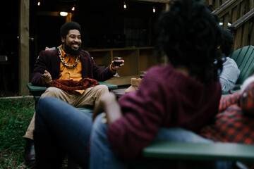 Black friends safely gathered and enjoying a backyard kickback party