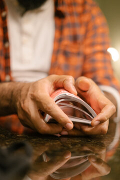 Black male hands shuffling and dealing playing cards