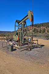 Oil pump painted to match the surrounding landscape 