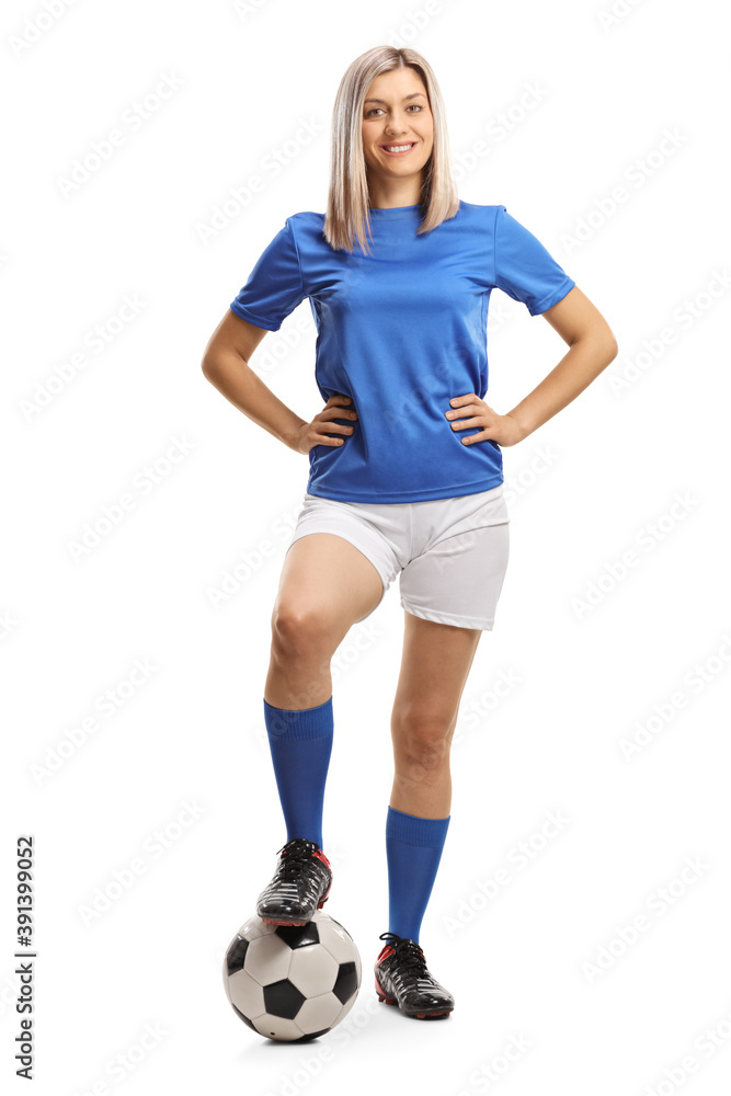 Poster full length portrait of a female football player posing with a soccer ball