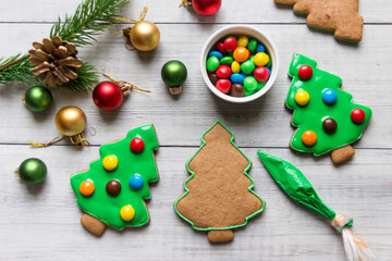 Homemade Christmas gingerbread cookies decorated with colorful candies.