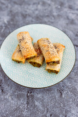 plant-based food, vegan spinace pesto and dairy free cheese pastry rolls