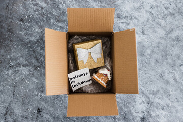 winter holidays in lockdown, gifts being delivered via postal parcel with Christmas themed items...