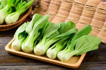 Fresh Bok Choy or Pak Choi(Chinese cabbage) on wooden tray, Organic vegetables