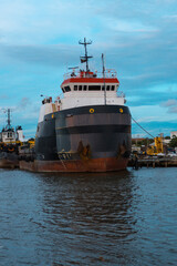 Fototapeta premium Offshore oil and gas research vessel underway in port channel.