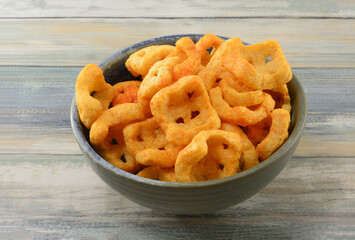 Red hot chili pepper bites snack in bowl on table