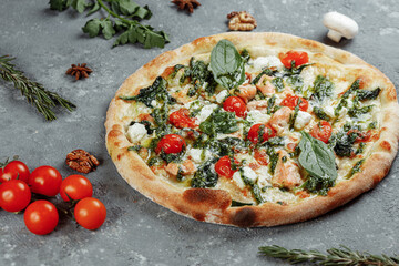Real Italian delicious pizza with salmon and cheese