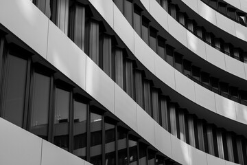 Black and white tone, close-up and detail of exterior curvature facade with contrast colour...