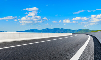 New asphalt road and green mountain with sky cloud natural landscape.