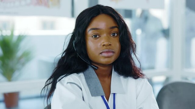 Portrait of nice looking cheerful african young woman nurse doctor medical therapist worker intern employee in medical office hospital. Professional people. Confidence.
