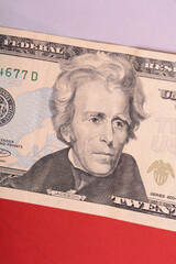 twenty dollar bill in front of the American flag