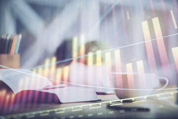Multi exposure of forex graph drawing and desktop with coffee and items on table background....