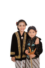 Happy portrait of two adorable brothers and sisters. In Javanese outfit concept isolated on a white background