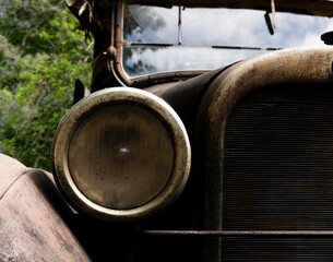 Fototapeta na wymiar detail of rusted headlight on vintage ute.